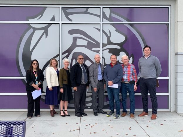 From left, Veronica Machado, principal; Amy Phillips, president, Pasco SD board of directors; Michelle Whitney, superintendent; Raul Sital, assistant superintendent, operations; Steven Clark, Integrus Architects, Assn for Learning Environments (A4LE); Sen. Boehnke; Mitch Denning, WAMOA consultant; Kyle Lepper, LPR Architecture, American Institute of Architects (AIAWA). Not shown, Carla Lobas, assistant superintendent, instructional services; Josh Collop, manager, maintenance and custodial; Anna Tennsmeyer, director, public affairs, and Kevin Hebdon, executive director, fiscal services.